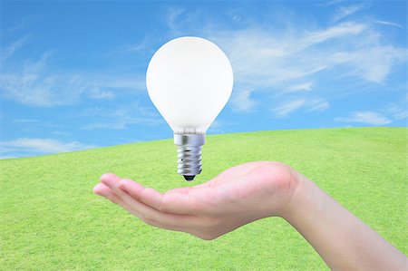 simsearch:400-04265413,k - light bulb in women hand on sky Stock Photo - Budget Royalty-Free & Subscription, Code: 400-04418894