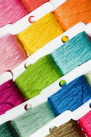 A selection of brightly coloured cotton threads on bobbins Stock Photo - Budget Royalty-Free & Subscription, Code: 400-04419248