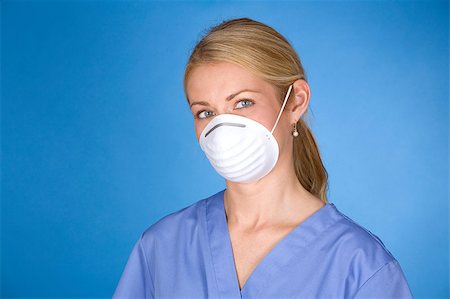 blond healthcare worker wearing blue scrubs and mask Stock Photo - Budget Royalty-Free & Subscription, Code: 400-04419519