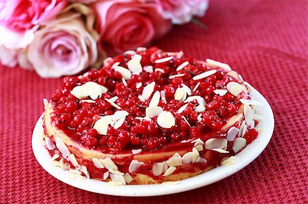 Delicious cheesecake with redcurrant and almond Stock Photo - Budget Royalty-Free & Subscription, Code: 400-04419865