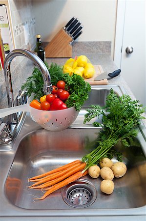 simsearch:400-06864386,k - Fresh vegetables, herbs, and fruit being prepared in the kitchen Stock Photo - Budget Royalty-Free & Subscription, Code: 400-04419929