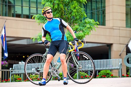 Male bike rider resting in downtown Stock Photo - Budget Royalty-Free & Subscription, Code: 400-04410069