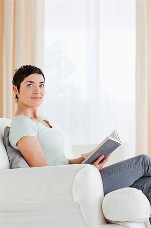 simsearch:400-04418460,k - Portrait of a short-haired woman holding a book Stock Photo - Budget Royalty-Free & Subscription, Code: 400-04410676