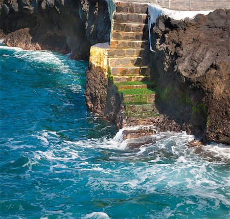 rocks water mist sky - A stair down to the blue water in Tenerife, Spain Stock Photo - Budget Royalty-Free & Subscription, Code: 400-04411804