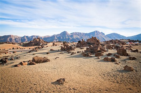 A spot in Tenerife with many rocks and a beautiful mountain landscape in the background Stock Photo - Budget Royalty-Free & Subscription, Code: 400-04411810