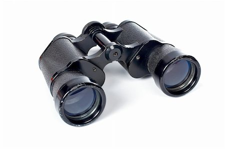 Used black binoculars with shadow on a white background. Shallow DOF Stock Photo - Budget Royalty-Free & Subscription, Code: 400-04426369