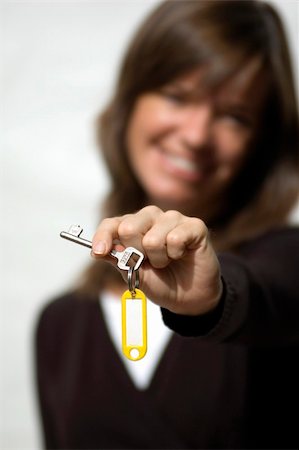 Isloated model on white background with new house keys Foto de stock - Super Valor sin royalties y Suscripción, Código: 400-04426962