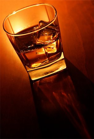simsearch:400-04558755,k - Glass of whiskey and ice on brown bar counter Stock Photo - Budget Royalty-Free & Subscription, Code: 400-04427058
