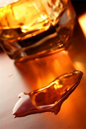 simsearch:400-04558755,k - Glass of whiskey with heart shaped liquid pool in front. Focus is on the heart. Stock Photo - Budget Royalty-Free & Subscription, Code: 400-04427059