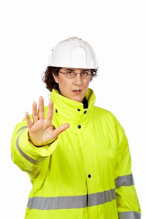 Serious female construction worker saying stop, over a white background. Eyes on focus Stock Photo - Budget Royalty-Free & Subscription, Code: 400-04428295