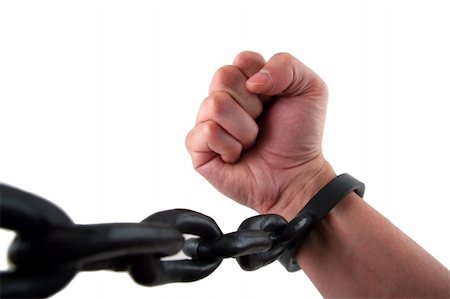 Male Hand with Fist Chained to Linked Cuffs Stock Photo - Budget Royalty-Free & Subscription, Code: 400-04429528