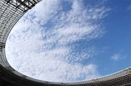 soccer arena - View on clouds through stadium roof. The Donbass Arena (Donetsk, Ukraine) is the first stadium in Eastern Europe designed and built to UEFA elite standards. Arena for semifinals Euro-2012. Stock Photo - Budget Royalty-Free & Subscription, Code: 400-04421080
