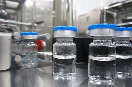 pharmaceutical plant - Bottles in the processing machine in a pharmaceutical plant Stock Photo - Budget Royalty-Free & Subscription, Code: 400-04421863