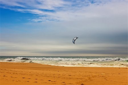 simsearch:400-03992760,k - Kiteboarding at Guincho beach located close to the Portuguese city of Cascais. Stock Photo - Budget Royalty-Free & Subscription, Code: 400-04422877