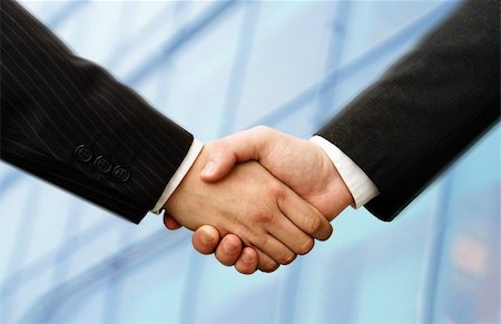 simsearch:400-04434336,k - business hand shake and a office in background, slightly motion blur in the Suits, focus at the hands Stock Photo - Budget Royalty-Free & Subscription, Code: 400-04434336