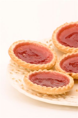flaky - Strawberry Jam Tarts on a plate against a white background. Stock Photo - Budget Royalty-Free & Subscription, Code: 400-04434674