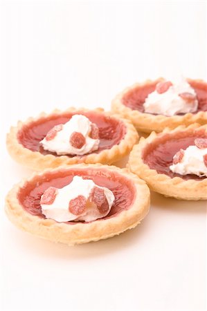 flaky - Strawberry Jam Tarts with cream against a white background. Stock Photo - Budget Royalty-Free & Subscription, Code: 400-04434675