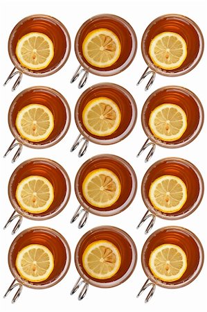 simsearch:400-04273561,k - Many glass cups of tea with one slice of lemon forming background Stock Photo - Budget Royalty-Free & Subscription, Code: 400-04434851