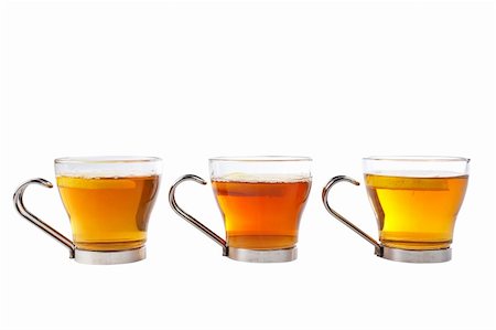 simsearch:400-04273561,k - Three glass cups of tea with one slice of lemon. Shallow dof Stock Photo - Budget Royalty-Free & Subscription, Code: 400-04434852