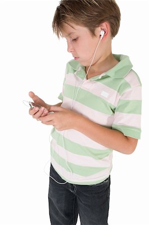 simsearch:400-05748462,k - A casual dressed child using an mp3 music player. Stock Photo - Budget Royalty-Free & Subscription, Code: 400-04435517