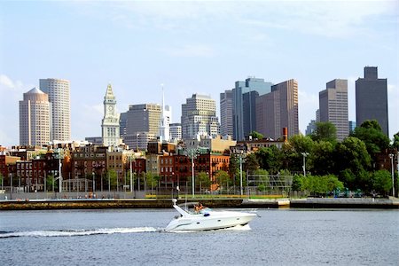 simsearch:400-04198862,k - Motorboat in a harbor in front of a Boston skyline on a sunny summer day Stock Photo - Budget Royalty-Free & Subscription, Code: 400-04430094