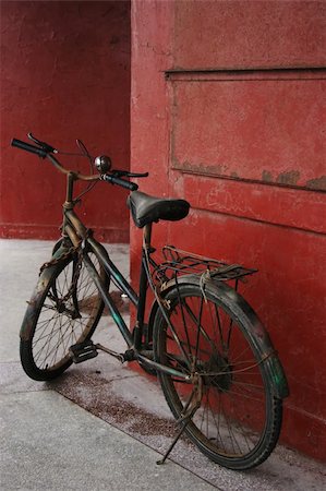 simsearch:400-08938779,k - Old bike parked next to a red wall. Stock Photo - Budget Royalty-Free & Subscription, Code: 400-04430303