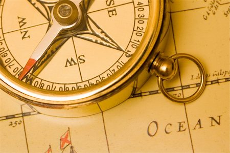 Old style brass compass on antique  map Stock Photo - Budget Royalty-Free & Subscription, Code: 400-04430868