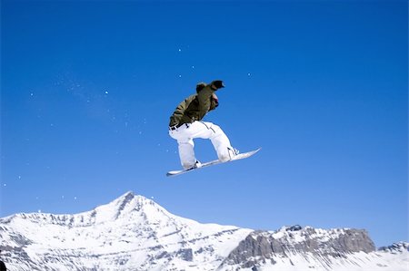 simsearch:400-03985663,k - a snowboarder jumping high through a blue sky Stock Photo - Budget Royalty-Free & Subscription, Code: 400-04431107