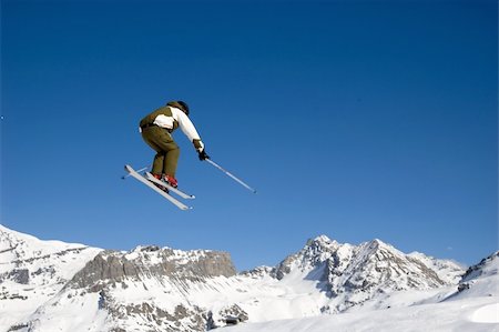 simsearch:400-03985663,k - a skier jumping high through a blue sky, above the mountains Stock Photo - Budget Royalty-Free & Subscription, Code: 400-04431108