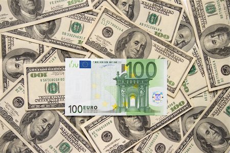 simsearch:400-04529024,k - Lonely one hundred euros over handreds of dollars Stock Photo - Budget Royalty-Free & Subscription, Code: 400-04433696