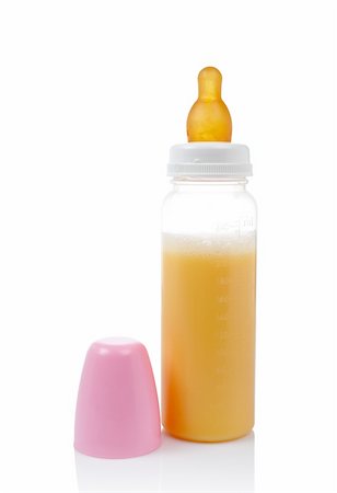 simsearch:400-06751007,k - Baby bottle with milk reflected on white background Stock Photo - Budget Royalty-Free & Subscription, Code: 400-04446735