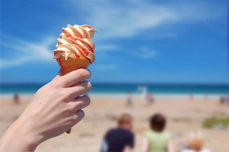 simsearch:400-05718903,k - A person holding an ice cream on a beach Stock Photo - Budget Royalty-Free & Subscription, Code: 400-04447498