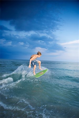 Caucasian male teen riding skimboard. Stock Photo - Budget Royalty-Free & Subscription, Code: 400-04448949