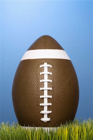 pigskin - Studio shot of football resting in grass. Stock Photo - Budget Royalty-Free & Subscription, Code: 400-04449202