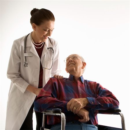 Mid-adult Caucasian female doctor looking at an elderly Caucasian male in wheelchair. Stock Photo - Budget Royalty-Free & Subscription, Code: 400-04449867