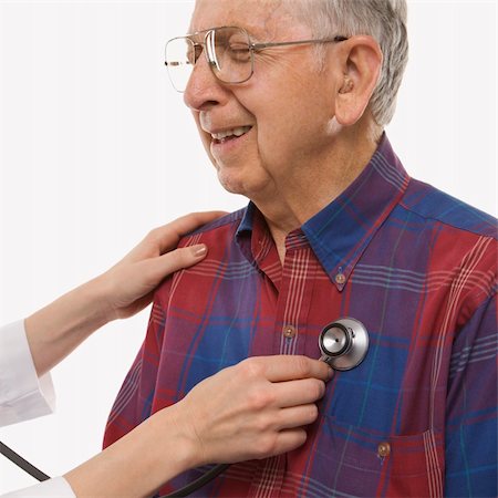 Mid-adult Caucasian female hands listening  to elderly Caucasian male's heart with stethoscope. Stock Photo - Budget Royalty-Free & Subscription, Code: 400-04449871