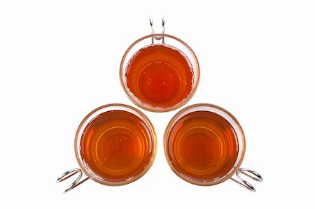 simsearch:400-04273561,k - Three glass cups of tea. Shallow dof and path included Stock Photo - Budget Royalty-Free & Subscription, Code: 400-04440459