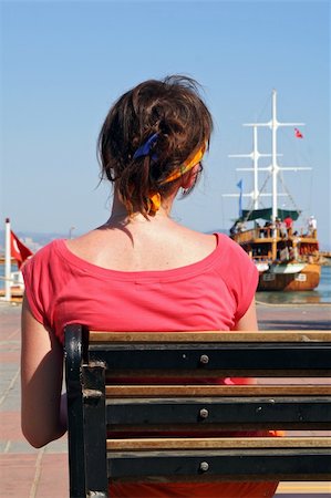simsearch:400-04433053,k - woman sitting on bench and observing harboured ships Stock Photo - Budget Royalty-Free & Subscription, Code: 400-04454899