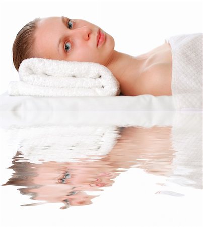 simsearch:400-06137898,k - Woman laying on towel over white Foto de stock - Super Valor sin royalties y Suscripción, Código: 400-04455367