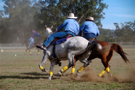 Two horsemen riding side by side at a country fair Stock Photo - Budget Royalty-Free & Subscription, Code: 400-04458961