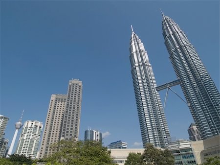Kuala Lumpur skyline with considerable perspective distortion. Petronas Twin Towers to the right and Kuala Lumpur (KL) Tower at the lower left corner. Stock Photo - Budget Royalty-Free & Subscription, Code: 400-04459622
