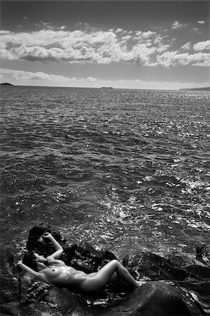 Nude Caucasian mid adult woman nestled in watery alcove at Maui coast. Stock Photo - Budget Royalty-Free & Subscription, Code: 400-04450797