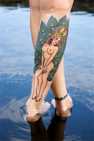 simsearch:400-04450827,k - Close up of Caucasian woman's legs covered with sexy tattoos. Stock Photo - Budget Royalty-Free & Subscription, Code: 400-04450899