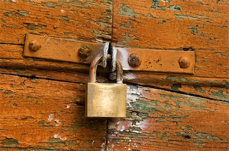 Image shows a padlock on a highly textured door Stock Photo - Budget Royalty-Free & Subscription, Code: 400-04453349