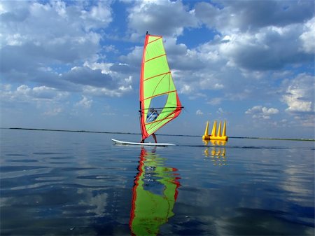 simsearch:400-03992760,k - Windsurfer and its reflection in water of a gulf Stock Photo - Budget Royalty-Free & Subscription, Code: 400-04453628