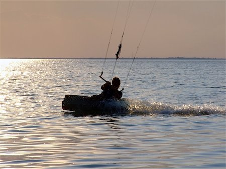 simsearch:400-03992760,k - Silhouettes kitesurf on a gulf on a sunset 2 Stock Photo - Budget Royalty-Free & Subscription, Code: 400-04453654