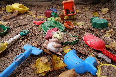 simsearch:400-05064616,k - Forgotten toys in a dirty sandbox. Depressive mood. Photographie de stock - Aubaine LD & Abonnement, Code: 400-04465026