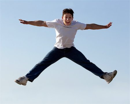 Boy jumping high in the air Stock Photo - Budget Royalty-Free & Subscription, Code: 400-04467219