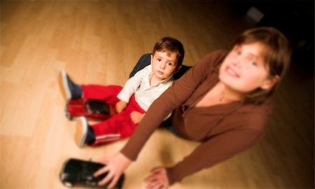 little boy and mother playing indoor with model cars Stock Photo - Budget Royalty-Free & Subscription, Code: 400-04467627