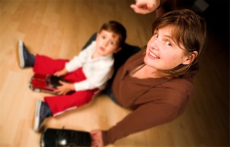 little boy and mother playing indoor with model cars Stock Photo - Budget Royalty-Free & Subscription, Code: 400-04467628